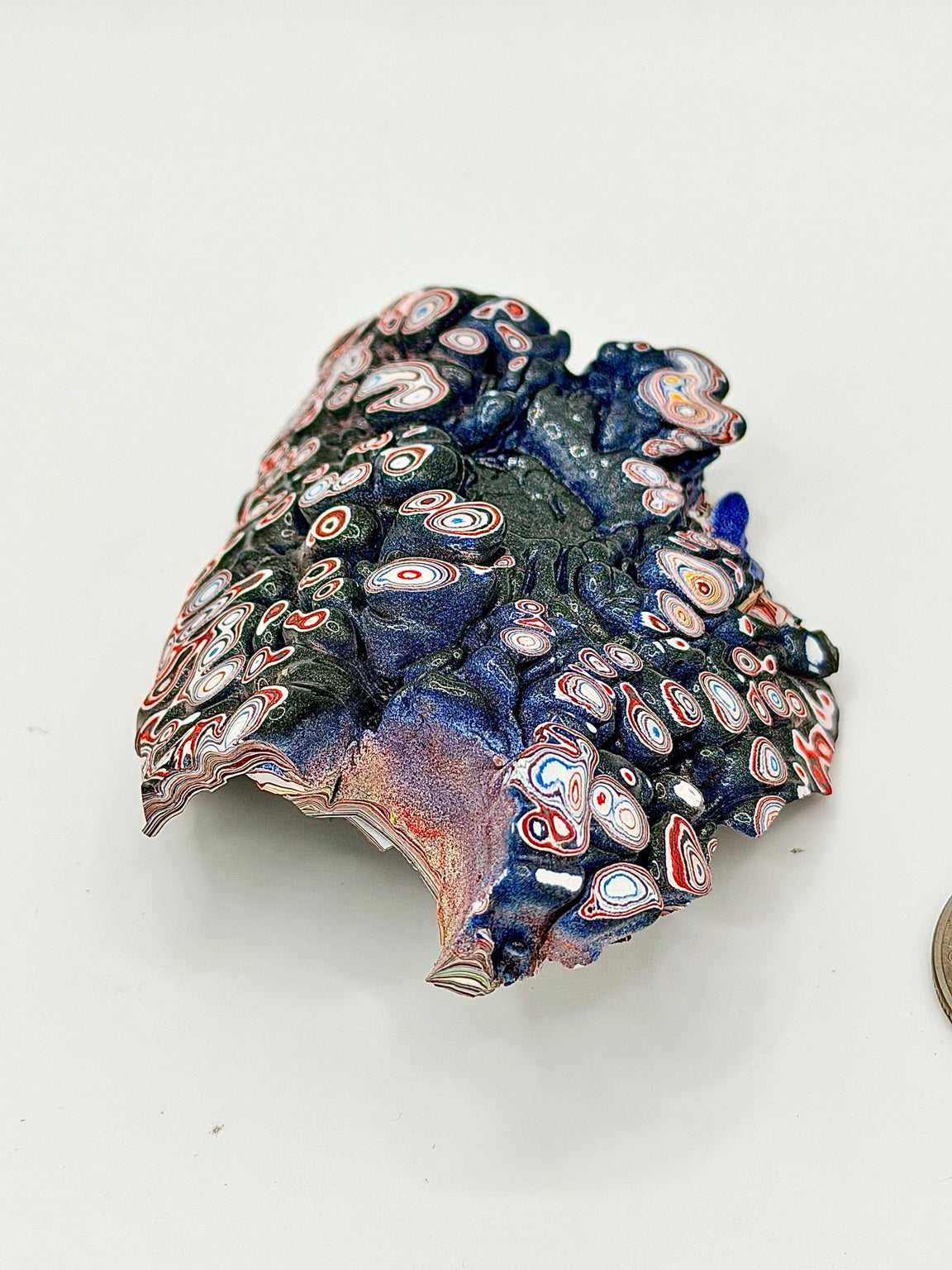 Vintage Kenworth Fordite raw specimen showing textured paint buildup and exposed layers